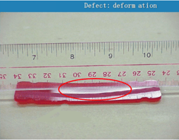 Deformation defect on pink plastic